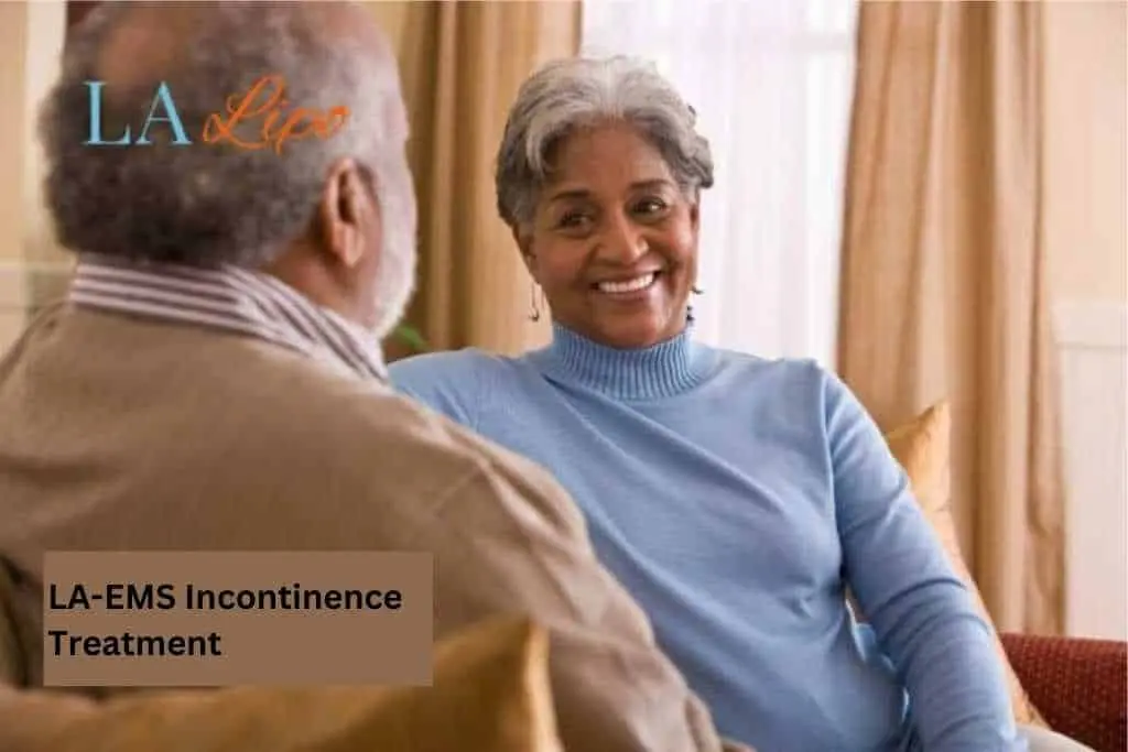 Couple sat smiling at each other - LA-EMS treatment Salford