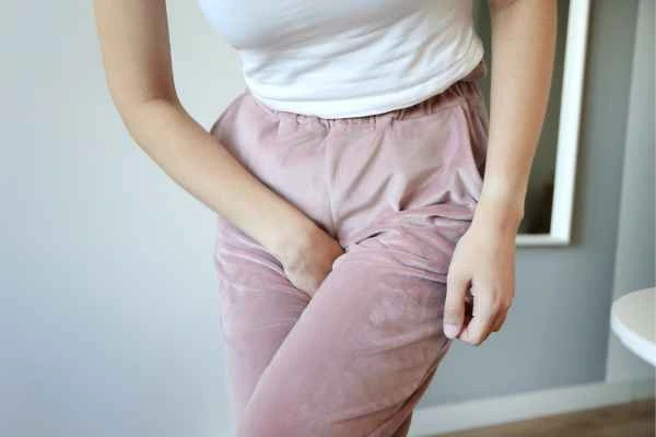 older woman running to the toilet because of urinary incontinence Salford